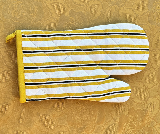 Yellow, white, and black striped cotton oven mitt from cotton table linen collection