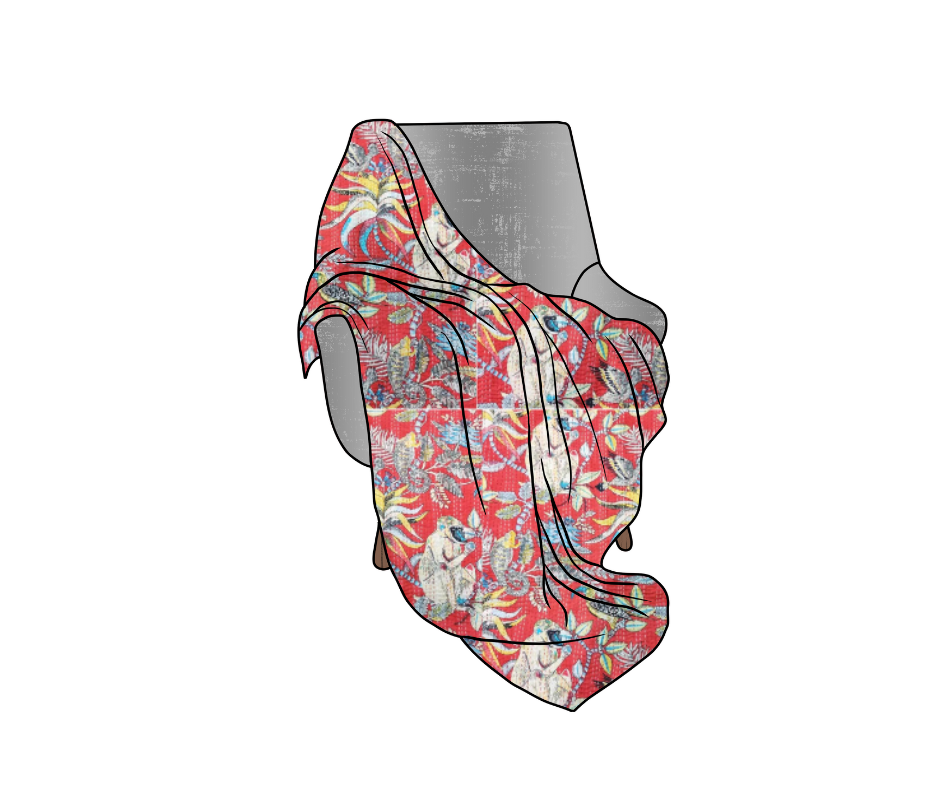 Handmade cotton Kantha blanket with colorful monkey print draped over a gray chair, lightweight and quilted for home decor or gift.