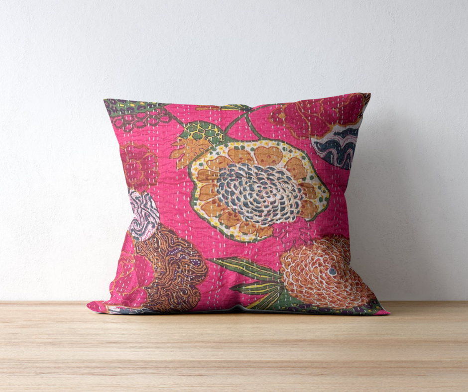 Hand-stitched Kantha throw pillow with vibrant floral patterns on pink cotton silk cover, reversible solid backing, handmade in India